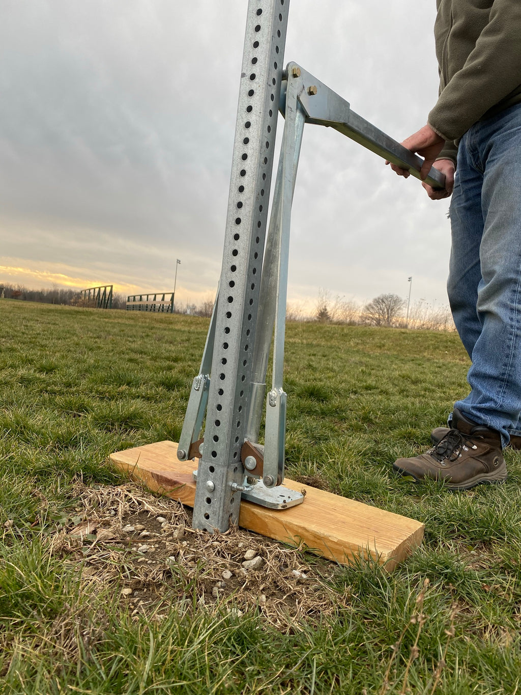 Use a wood board on soft soil